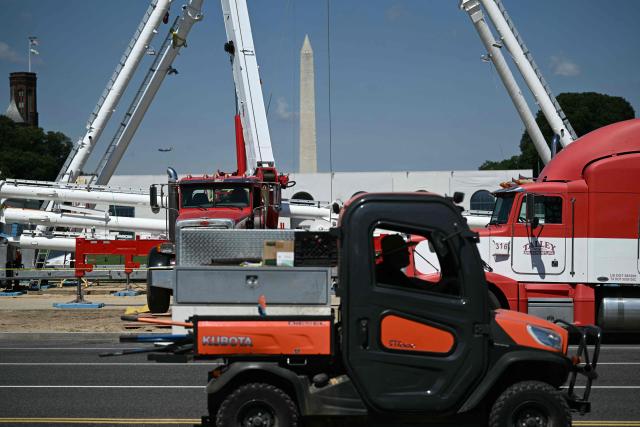 A Ferris wheel is being assembled as preparations continue for the "Great American State Fair" on the National Mall in Washington, DC, June 17, 2026. The "Great American State Fair" will be held from June 25 to July 10, 2026, to celebrate the 250th anniversary of US independence. (Photo by Brendan SMIALOWSKI / AFP)