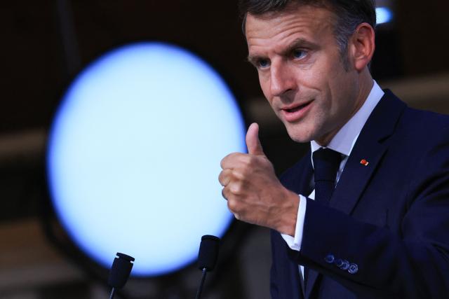 TOPSHOT - France's President Emmanuel Macron gestures as he speaks during the closing press conference of the G7 summit, in Evian, eastern France, on June 17, 2026. A G7 summit is set to take place June 15 to 17 in the French town of Evian-les-Bains near Switzerland and it will be attended by country leaders as well as the EU's foreign policy chief and ministers from Brazil, Canada, the United Arab Emirates and Turkey. (Photo by Ludovic MARIN / AFP)