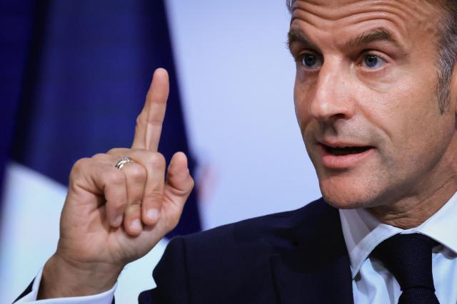 France's President Emmanuel Macron gestures as he speaks during the closing press conference of the G7 summit, in Evian, eastern France, on June 17, 2026. A G7 summit is set to take place June 15 to 17 in the French town of Evian-les-Bains near Switzerland and it will be attended by country leaders as well as the EU's foreign policy chief and ministers from Brazil, Canada, the United Arab Emirates and Turkey. (Photo by Ludovic MARIN / AFP)