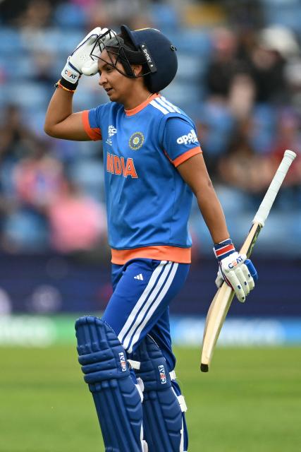 India's captain Harmanpreet Kaur walks off after being dismissed during the ICC Women's T20 cricket world cup 2026 game between India and The Netherlands, at Headingley in Leeds, northern England on June 17, 2026. (Photo by Oli SCARFF / AFP)