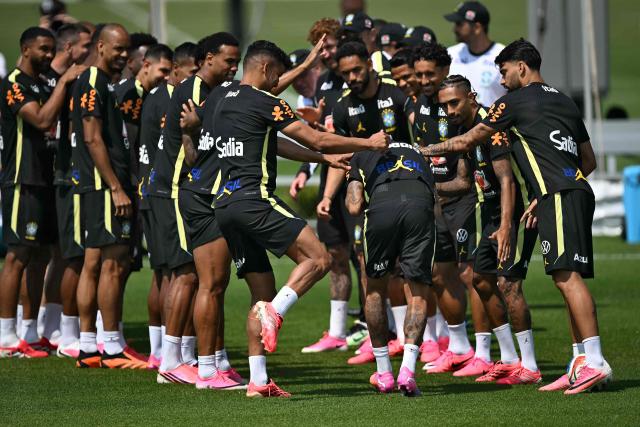 Brazil's forward #10 Neymar walks through a guard of honor formed by teammates during a training session ahead of Brazil's 2026 World Cup football tournament Group C football match against Haiti in Morris Township on June 17, 2026.  (Photo by MAURO PIMENTEL / AFP)
