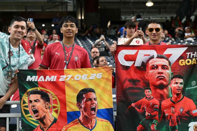 Portugal supporters pose with poses depicting Portugal's forward #07 Cristiano Ronaldo in the tribunes prior to the 2026 World Cup Group K football match between Portugal and the Democratic Republic of Congo at the Houston Stadium in Houston on June 17, 2026.  (Photo by RONALDO SCHEMIDT / AFP)