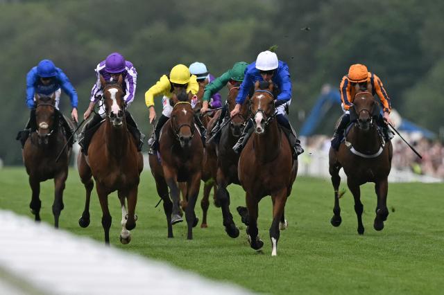 Jockey William Buick rides Ombudsman (2R) to win the Prince Of Wales's Stakes horse race on the second day of the Royal Ascot horse racing meeting in Ascot, west of London, on June 17, 2026. (Photo by JUSTIN TALLIS / AFP)