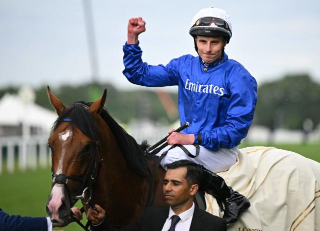 Jockey William Buick celebrates riding Ombudsman to win the Prince Of Wales's Stakes horse race on the second day of the Royal Ascot horse racing meeting in Ascot, west of London, on June 17, 2026. (Photo by JUSTIN TALLIS / AFP)