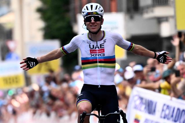 Slovenia's rider Tadej Pogacar of team UAE Emirates - XRG celebrates as he crosses the finish line to win the first stage of the Men's Tour of Switzerland (Tour de Suisse) cycling race, in Sondrio, Italy, on June 17, 2026. (Photo by Marco BERTORELLO / AFP)