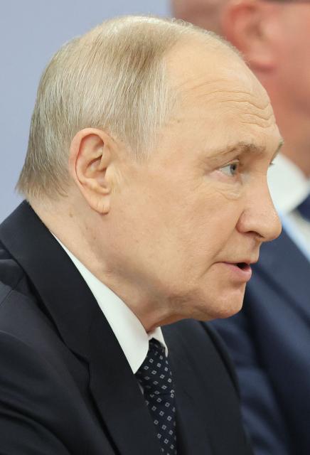 Russia's President Vladimir Putin attends a meeting with Brunei's Sultan on the sidelines of the Russia-ASEAN summit, which commemorates 35 years of collaboration between Russia and the ASEAN countries, in the central Russian city of Kazan, around 700 kilometres (435 miles) east of the capital Moscow, on June 17, 2026. (Photo by Anastasia Barashkova / POOL / AFP)