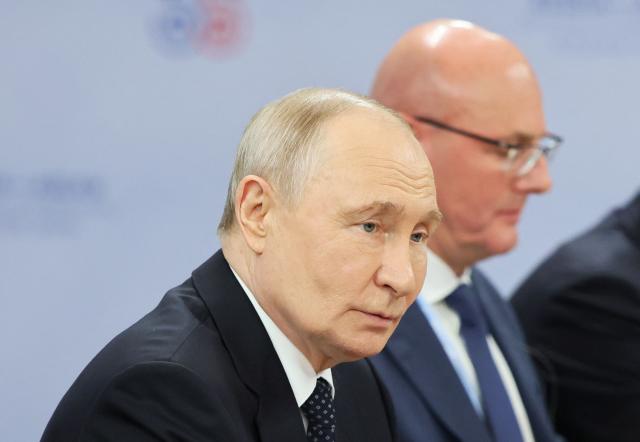 Russia's President Vladimir Putin attends a meeting with Brunei's Sultan on the sidelines of the Russia-ASEAN summit, which commemorates 35 years of collaboration between Russia and the ASEAN countries, in the central Russian city of Kazan, around 700 kilometres (435 miles) east of the capital Moscow, on June 17, 2026. (Photo by Anastasia Barashkova / POOL / AFP)