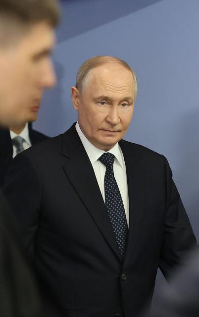 Russia's President Vladimir Putin arrives for a meeting with Brunei's Sultan on the sidelines of the Russia-ASEAN summit, which commemorates 35 years of collaboration between Russia and the ASEAN countries, in the central Russian city of Kazan, around 700 kilometres (435 miles) east of the capital Moscow, on June 17, 2026. (Photo by Anastasia Barashkova / POOL / AFP)