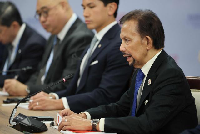 Brunei's Sultan Hassanal Bolkiah attends a meeting with Russia's President on the sidelines of the Russia-ASEAN summit, which commemorates 35 years of collaboration between Russia and the ASEAN countries, in the central Russian city of Kazan, around 700 kilometres (435 miles) east of the capital Moscow, on June 17, 2026. (Photo by Anastasia Barashkova / POOL / AFP)