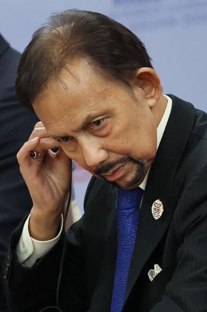 Brunei's Sultan Hassanal Bolkiah attends a meeting with Russia's President on the sidelines of the Russia-ASEAN summit, which commemorates 35 years of collaboration between Russia and the ASEAN countries, in the central Russian city of Kazan, around 700 kilometres (435 miles) east of the capital Moscow, on June 17, 2026. (Photo by Anastasia Barashkova / POOL / AFP)