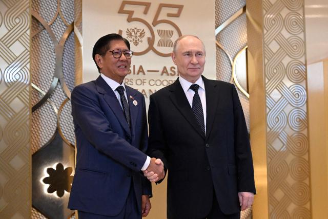 Russia's President Vladimir Putin greets Philippine President Ferdinand Marcos Jr. during a ceremony to welcome Southeast Asian leaders and heads of delegations participating in the Russia-ASEAN summit, which commemorates 35 years of collaboration between Russia and the ASEAN countries, in the central Russian city of Kazan, around 700 kilometres (435 miles) east of the capital Moscow, on June 17, 2026. (Photo by Alexander NEMENOV / AFP)