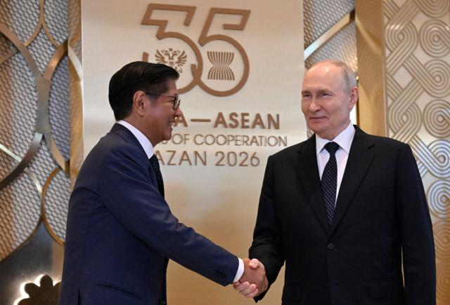 Russia's President Vladimir Putin greets Philippine President Ferdinand Marcos Jr. during a ceremony to welcome Southeast Asian leaders and heads of delegations participating in the Russia-ASEAN summit, which commemorates 35 years of collaboration between Russia and the ASEAN countries, in the central Russian city of Kazan, around 700 kilometres (435 miles) east of the capital Moscow, on June 17, 2026. (Photo by Alexander NEMENOV / AFP)