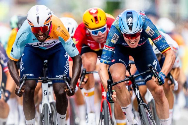 NSN Cycling Team's Eritrean rider Biniam Girmay (L) and Soudal Quick-Step's Belgian rider Tim Merlier (R) sprint to the finish line of the Tour of Belgium cycling race, 187.9 km starting and finishing in Scherpenheuvel-Zichem, on June 17, 2026. The Belgium Tour takes place from 17 to 21 June. (Photo by JASPER JACOBS / Belga / AFP) / Belgium OUT