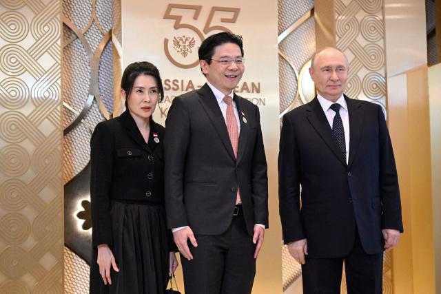 Russia's President Vladimir Putin greets Singapore's Prime Minister Lawrence Wong during a ceremony to welcome Southeast Asian leaders and heads of delegations participating in the Russia-ASEAN summit, which commemorates 35 years of collaboration between Russia and the ASEAN countries, in the central Russian city of Kazan, around 700 kilometres (435 miles) east of the capital Moscow, on June 17, 2026. (Photo by Alexander NEMENOV / AFP)