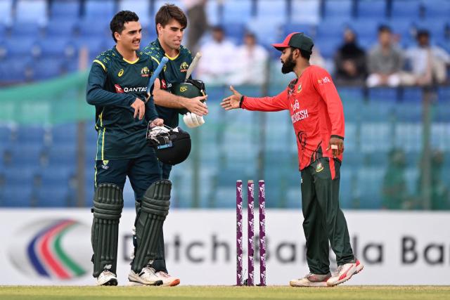 Australia's Joel Davies (L) and Xavier Bartlett (C) celebrate their team's win against Bangladesh at the end of their first Twenty20 international cricket match in the Bir Sreshtho Flight Lieutenant Matiur Rahman Stadium of Chattogram on June 17, 2026. (Photo by AFP)
