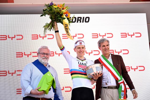 Slovenia's rider Tadej Pogacar of team UAE Emirates - XRG celebrates on the podium of the first stage of the Men's Tour of Switzerland (Tour de Suisse) cycling race, in Sondrio, Italy, on June 17, 2026. (Photo by Marco BERTORELLO / AFP)
