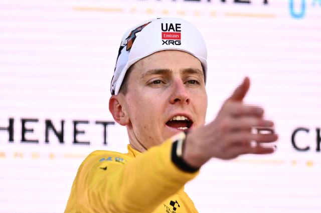Slovenia's rider Tadej Pogacar of team UAE Emirates - XRG celebrates on the podium of the first stage of the Men's Tour of Switzerland (Tour de Suisse) cycling race, in Sondrio, Italy, on June 17, 2026. (Photo by Marco BERTORELLO / AFP)