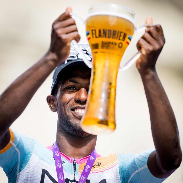 Stage winner NSN Cycling Team's Eritrean rider Biniam Girmay (C) celebrates on the podium of the Tour of Belgium cycling race after the 1st stage, 187.9 km starting and finishing in Scherpenheuvel-Zichem, on June 17, 2026. The Belgium Tour takes place from 17 to 21 June. (Photo by JASPER JACOBS / Belga / AFP) / Belgium OUT