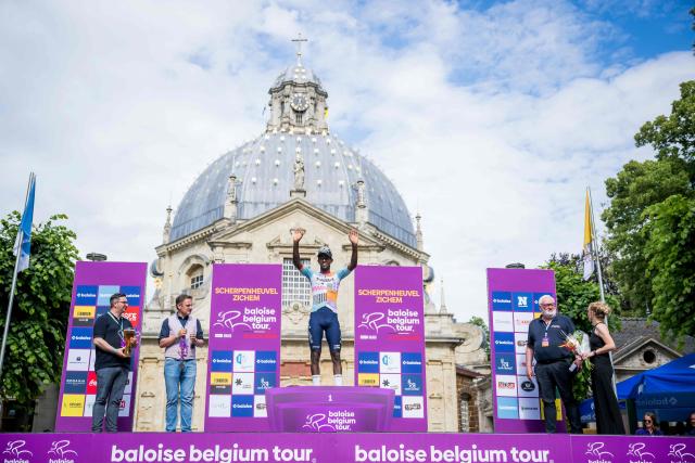 Stage winner NSN Cycling Team's Eritrean rider Biniam Girmay (C) celebrates on the podium of the Tour of Belgium cycling race after the 1st stage, 187.9 km starting and finishing in Scherpenheuvel-Zichem, on June 17, 2026. The Belgium Tour takes place from 17 to 21 June. (Photo by JASPER JACOBS / Belga / AFP) / Belgium OUT