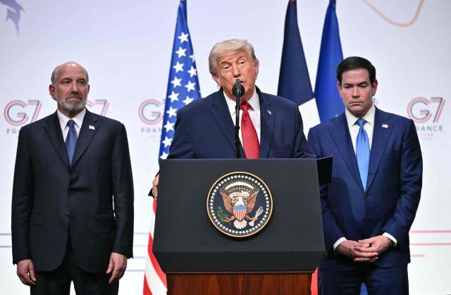 US President Donald Trump (C) addresses the media alongside US Secretary of State Marco Rubio (R) and US Commerce secretary Howard Lutnick (L) during a closing press conference at the G7 summit, in Evian, eastern France, on June 17, 2026. A G7 summit is set to take place June 15 to 17 in the French town of Evian-les-Bains near Switzerland and it will be attended by country leaders as well as the EU's foreign policy chief and ministers from Brazil, Canada, the United Arab Emirates and Turkey. (Photo by Mandel NGAN / AFP)
