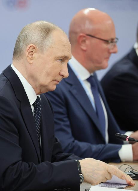 Russia's President Vladimir Putin attends a meeting with Brunei's Sultan on the sidelines of the Russia-ASEAN summit, which commemorates 35 years of collaboration between Russia and the ASEAN countries, in the central Russian city of Kazan, around 700 kilometres (435 miles) east of the capital Moscow, on June 17, 2026. (Photo by Anastasia Barashkova / POOL / AFP)