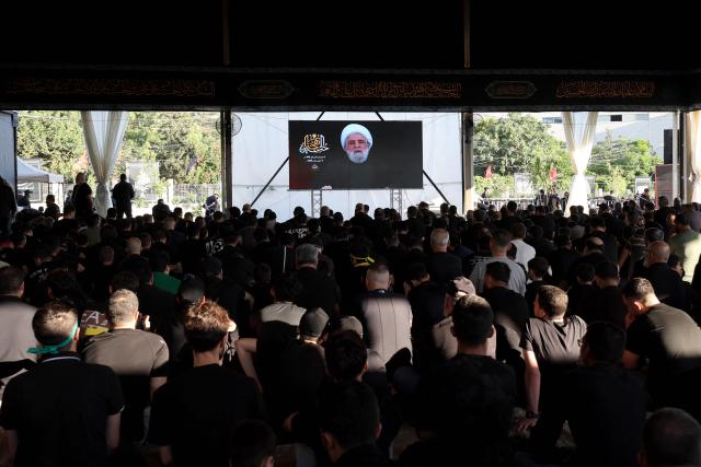 Hezbollah Secretary-General Sheikh Naim Qassem addresses crowds via a giant screen during the first day of Ashura commemorations at the mausoleum of former Hezbollah leader Hassan Nasrallah in Beirut’s southern suburbs on June 17, 2026. Qassem said on June 17 that Lebanon's negotiations with Israel should be limited to "mutual security", and that the country's main demand should be restoring its sovereignty after Israeli troops invaded the south. (Photo by Anwar AMRO / AFP)