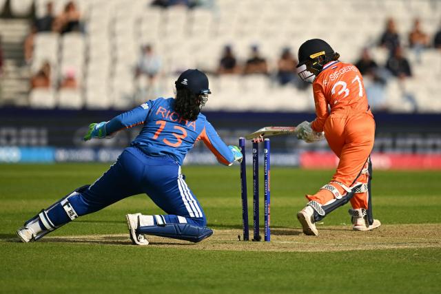 India's Richa Ghosh (L) stumps Netherlands' Silver Siegers (R) for the out during the ICC Women's T20 cricket world cup 2026 game between India and The Netherlands, at Headingley in Leeds, northern England on June 17, 2026. (Photo by Oli SCARFF / AFP)