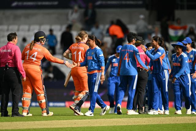 Players shake hands at the end of the ICC Women's T20 cricket world cup 2026 game between India and The Netherlands, at Headingley in Leeds, northern England on June 17, 2026. (Photo by Oli SCARFF / AFP)