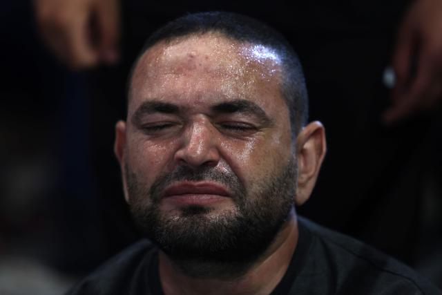 A man reacts as Hezbollah Secretary-General Sheikh Naim Qassem addresses crowds via a giant screen during the first day of Ashura commemorations at the mausoleum of former Hezbollah leader Hassan Nasrallah in Beirut’s southern suburbs on June 17, 2026. Qassem said on June 17 that Lebanon's negotiations with Israel should be limited to "mutual security", and that the country's main demand should be restoring its sovereignty after Israeli troops invaded the south. (Photo by Anwar AMRO / AFP)