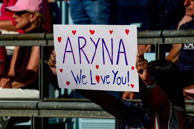 A fan of Berarus' Aryna Sabalenka holds up a placald with a message of affection as she plays against Russia's Ekaterina Alexandrova during the women's singles round of 16 tennis match at the WTA 500 Berlin Tennis Open tournament in Berlin on June 17, 2026. (Photo by John MACDOUGALL / AFP)