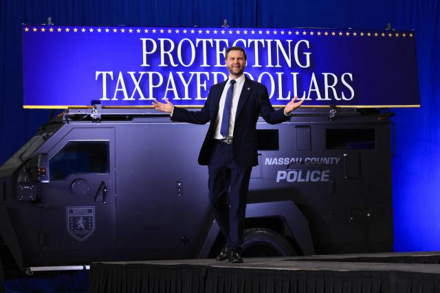 US Vice President JD Vance gestures as he arrives to deliver remarks on the administration's "crackdown on crime and fraud" during an event at Gold Coast Studios in Bethpage, New York, on June 17, 2026. Vance’s visit comes after the Justice Department filed a lawsuit this week against New York state officials over alleged Medicaid fraud related to the state’s $10 billion home-care program. (Photo by Spencer Platt / POOL / AFP)