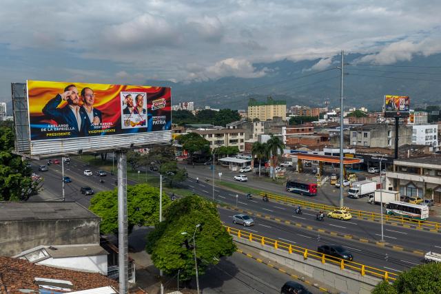 Aerial view of a billboard inviting to vote for presidential canditate Abelardo de la Espriella, of the Salvadores de la Patria movement, in the upcoming presidential election in Cali, Colombia, on June 17, 2026. Colombians vote on June 21, 2026 in a presidential runoff pitting a hard-right opera-singer-turned-lawyer against a leftist senator, an election with stark consequences for the country's stumbling peace process with armed groups and strained ties with Washington. (Photo by JOAQUIN SARMIENTO / AFP)