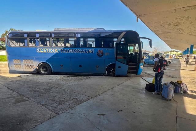 People arrive on a coach at Ciego de Avila, Cuba, on June 15, 2026. New restrictions on interprovincial transport in Cuba come into force on June 18, 2026, with trains running every 16 days, few weekly coaches and a state system for allocating tickets according to criteria of "urgency", amid a severe fuel shortage, under pressure from Washington. (Photo by AFP)