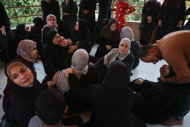 Displaced Palestinian women mourn loved ones killed in an Israeli airstrike during a funeral at Nasser Hospital in Khan Yunis, in the southern Gaza Strip, on June 17, 2026. A ceasefire has been in place in Gaza since October, but Israel reserves the right to strike targets it deems a threat. The territory remains gripped by daily violence as Israeli strikes continue, with both the military and Hamas accusing one another of violating the truce. (Photo by Bashar Taleb / AFP)
