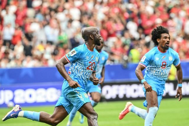 Congo DR's forward #20 Yoane Wissa (L) celebrates after scoring his team's first goal during the 2026 World Cup Group K football match between Portugal and the Democratic Republic of Congo at the Houston Stadium in Houston on June 17, 2026.  (Photo by RONALDO SCHEMIDT / AFP)