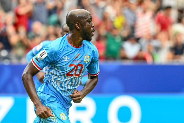Congo DR's forward #20 Yoane Wissa (L) celebrates after scoring his team's first goal during the 2026 World Cup Group K football match between Portugal and the Democratic Republic of Congo at the Houston Stadium in Houston on June 17, 2026.  (Photo by RONALDO SCHEMIDT / AFP)