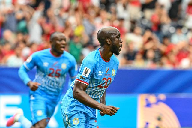 Congo DR's forward #20 Yoane Wissa (L) celebrates after scoring his team's first goal during the 2026 World Cup Group K football match between Portugal and the Democratic Republic of Congo at the Houston Stadium in Houston on June 17, 2026.  (Photo by RONALDO SCHEMIDT / AFP)