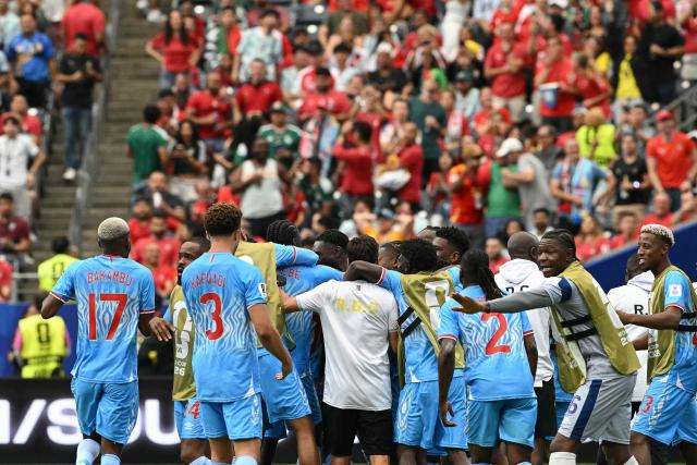 DR Congo players celebrate their first goal during the 2026 World Cup Group K football match between Portugal and the Democratic Republic of Congo at the Houston Stadium in Houston on June 17, 2026.  (Photo by RONALDO SCHEMIDT / AFP)