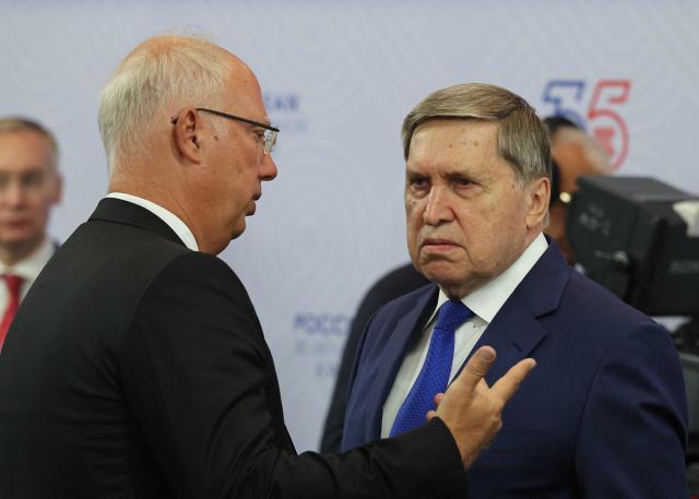 Kirill Dmitriev, the Russian presidential envoy and head of the Russian Direct Investment Fund, talks to Kremlin foreign policy adviser Yuri Ushakov before a meeting between Russian President and Malaysia's Prime Minister on the sidelines of the Russia-ASEAN summit, which commemorates 35 years of collaboration between Russia and the ASEAN countries, in the central Russian city of Kazan, around 700 kilometres (435 miles) east of the capital Moscow, on June 17, 2026. (Photo by Anastasia Barashkova / POOL / AFP)