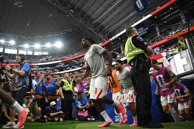 England's forward #20 Noni Madueke (C) arrives on the pitch prior to the  2026 World Cup Group L football match between England and Croatia at the Dallas Stadium in Arlington on June 17, 2026.  (Photo by Paul ELLIS / AFP)