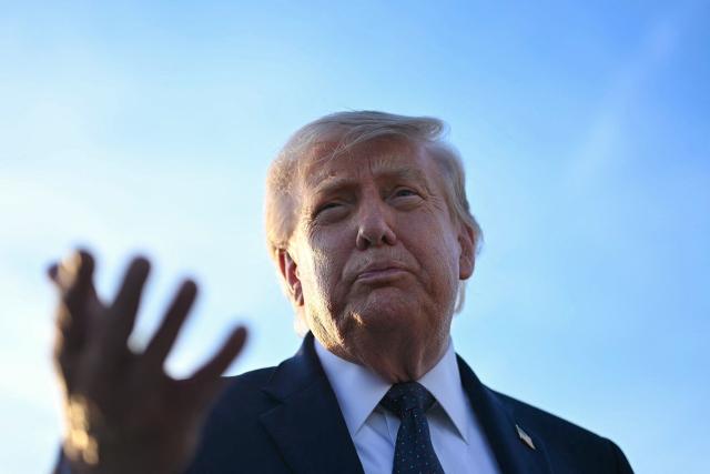 US President Donald Trump addresses the media on the tarmac after arriving at Paris Orly Airport enroute to a dinner to celebrate the 250th anniversary of the independence of the United States, at Orly Airport, south of Paris, on June 17, 2026. (Photo by Mandel NGAN / AFP)
