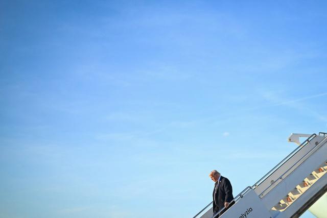 US President Donald Trump disembarks Air Force One upon arrival at Paris Orly Airport enroute to a dinner to celebrate the 250th anniversary of the independence of the United States, at Orly Airport, south of Paris, on June 17, 2026. (Photo by Mandel NGAN / AFP)