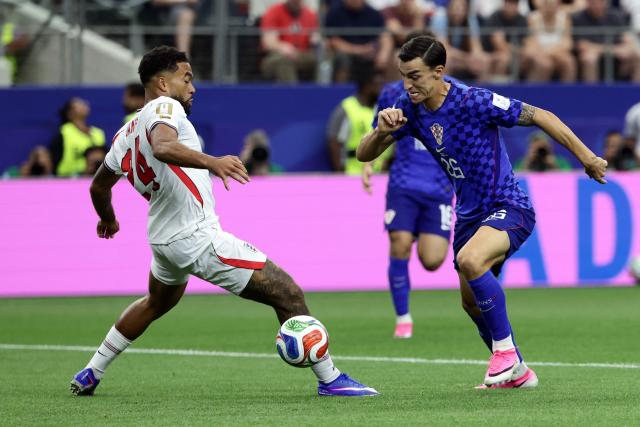 England's defender #24 Reece James (L) and Croatia's forward #26 Petar Musa (R) fight for the ball during the 2026 World Cup Group L football match between England and Croatia at the Dallas Stadium in Arlington on June 17, 2026.  (Photo by Aric Becker / AFP)
