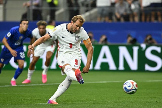 England's forward #09 Harry Kane shoots and scores a retaken penalty kick  during the 2026 World Cup Group L football match between England and Croatia at the Dallas Stadium in Arlington on June 17, 2026.  (Photo by Paul ELLIS / AFP)
