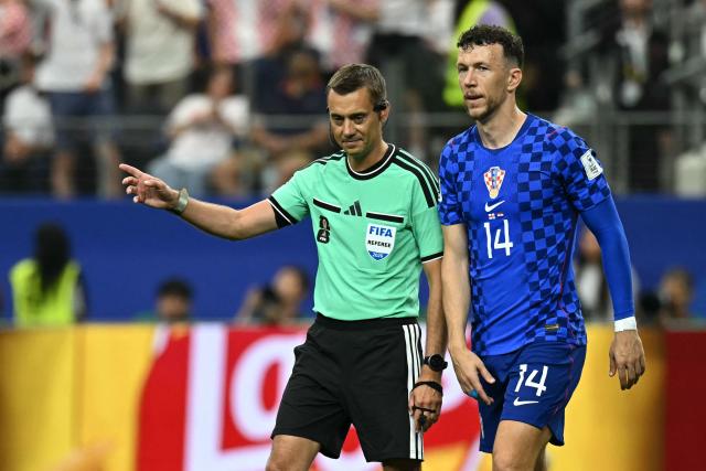 French referee Clement Turpin (L) gives a ruling for a penalty kick to be retaken during the 2026 World Cup Group L football match between England and Croatia at the Dallas Stadium in Arlington on June 17, 2026.  (Photo by Paul ELLIS / AFP)