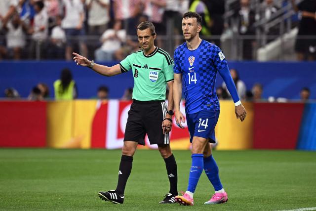 French referee Clement Turpin (L) gives a ruling for a penalty kick to be retaken  during the 2026 World Cup Group L football match between England and Croatia at the Dallas Stadium in Arlington on June 17, 2026.  (Photo by Paul ELLIS / AFP)