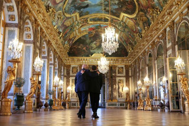 US President Donald Trump receives a tour of the Chateau de Versailles from French President Emmanuel Macron ahead of a dinner on June 17, 2026 in Versailles, France. The dinner followed the conclusion of this week's Group of 7 (G7) summit in Evian, France. (Photo by Anna Moneymaker / POOL / AFP)