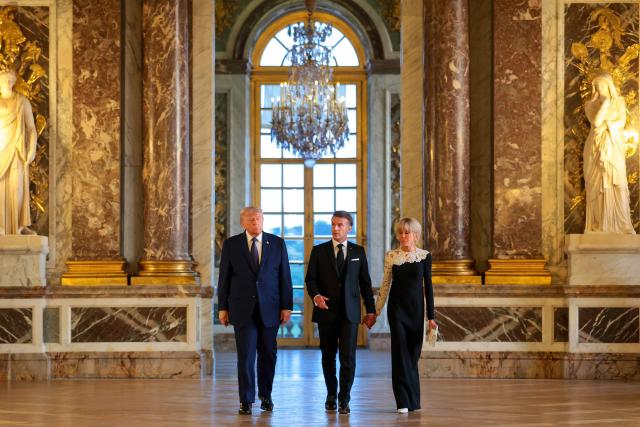 US President Donald Trump receives a tour of the Chateau de Versailles from French President Emmanuel Macron and his wife Brigitte Macron ahead of a dinner on June 17, 2026 in Versailles, France. The dinner followed the conclusion of this week's Group of 7 (G7) summit in Evian, France. (Photo by Anna Moneymaker / POOL / AFP)