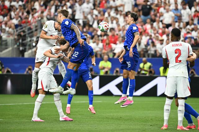 England's forward #09 Harry Kane (L) heads the ball and scores   his team's second goal  during the 2026 World Cup Group L football match between England and Croatia at the Dallas Stadium in Arlington on June 17, 2026.  (Photo by Paul ELLIS / AFP)