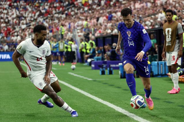 England's defender #24 Reece James (L) and Croatia's forward #14 Ivan Perisic (R) fight for the ball during the 2026 World Cup Group L football match between England and Croatia at the Dallas Stadium in Arlington on June 17, 2026.  (Photo by Aric Becker / AFP)